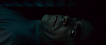 Movie still from “Sleep Tight” (2011), directed by Jaume Balagueró – A person's face in the dark; Extreme Close Up shot, Overhead angle