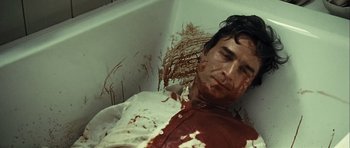 Movie still from “Sleep Tight” (2011), directed by Jaume Balagueró – A man in a bathtub covered in blood; Close Up shot, Overhead angle