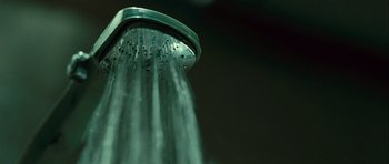 Movie still from “Sleep Tight” (2011), directed by Jaume Balagueró – View of a shower head with water droplets on it; Extreme Close Up shot, Low angle