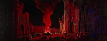 Movie still from “Sleeping Beauty” (1959), directed by Wolfgang Reitherman – A fire is burning in the middle of a castle; Extreme Wide shot, High angle