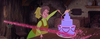 Movie still from “Sleeping Beauty” (1959), directed by Wolfgang Reitherman – A woman is cutting a birthday cake with a knife; Medium shot, High angle