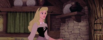 Movie still from “Sleeping Beauty” (1959), directed by Wolfgang Reitherman – A beautiful blonde woman standing next to a stone wall; Close Up shot, Over the shoulder angle