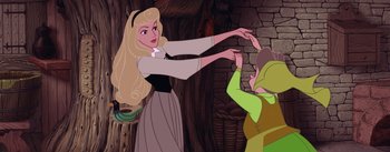 Movie still from “Sleeping Beauty” (1959), directed by Wolfgang Reitherman – A woman in a dress is reaching out to a man in a green suit; Medium shot, Overhead angle