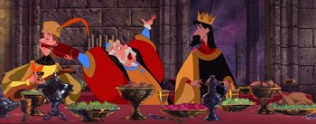 Movie still from “Sleeping Beauty” (1959), directed by Wolfgang Reitherman – Two animated characters sitting in front of a table; Medium shot, Over the shoulder angle