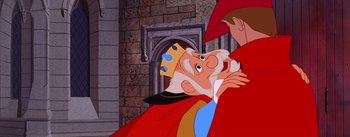 Movie still from “Sleeping Beauty” (1959), directed by Wolfgang Reitherman – A cartoon character with another character in the background; Close Up shot, Over the shoulder angle