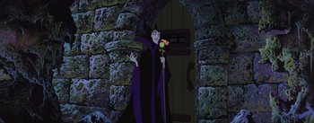 Movie still from “Sleeping Beauty” (1959), directed by Wolfgang Reitherman – The evil witch is standing in front of the door way; Wide shot, Over the shoulder angle