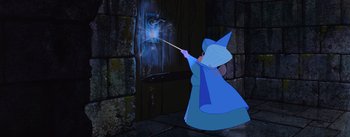 Movie still from “Sleeping Beauty” (1959), directed by Wolfgang Reitherman – A woman dressed as a wizard is casting a spell on a wall; Medium shot, High angle