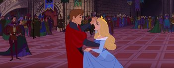 Movie still from “Sleeping Beauty” (1959), directed by Wolfgang Reitherman – A man and a woman dancing in front of a crowd; Medium shot, Over the shoulder angle