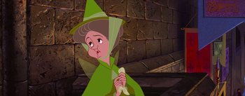 Movie still from “Sleeping Beauty” (1959), directed by Wolfgang Reitherman – A woman in a green outfit holding a banana; Close Up shot, Over the shoulder angle
