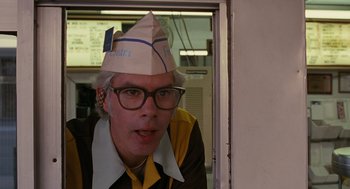 Movie still from “Sling Blade” (1996), directed by Billy Bob Thornton – A man with a paper hat on his head; Medium shot, Low angle