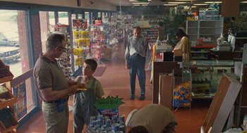 Movie still from “Sling Blade” (1996), directed by Billy Bob Thornton – A group of people standing around a grocery store; Wide shot, Over the shoulder angle