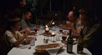 Movie still from “Sling Blade” (1996), directed by Billy Bob Thornton – A group of people sitting around a dinner table; Medium shot, High angle