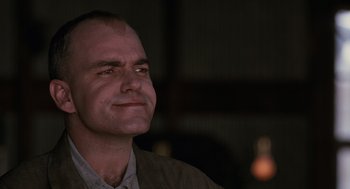 Movie still from “Sling Blade” (1996), directed by Billy Bob Thornton – A person looking up at the sky; Close Up shot, Low angle