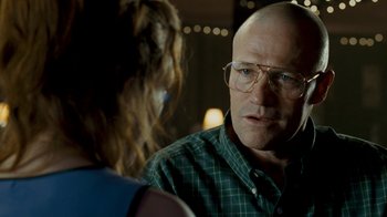 Movie still from “Slither” (2006), directed by James Gunn – A man and a woman are talking in a room; Close Up shot, Over the shoulder angle