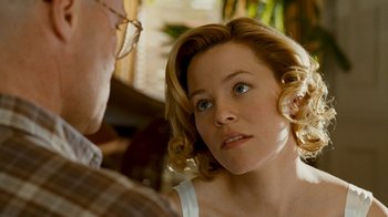 Movie still from “Slither” (2006), directed by James Gunn – A person looking at a mirror; Close Up shot, Over the shoulder angle