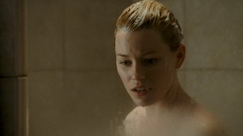 Movie still from “Slither” (2006), directed by James Gunn – A young woman is taking a shower in the bathroom; Close Up shot, Over the shoulder angle
