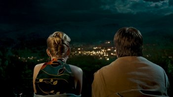 Movie still from “Slither” (2006), directed by James Gunn – A man and a woman looking out over a city at night; Medium shot, High angle