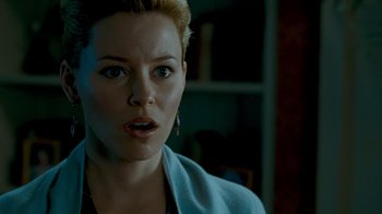 Movie still from “Slither” (2006), directed by James Gunn – A person with short blonde hair; Close Up shot, Over the shoulder angle