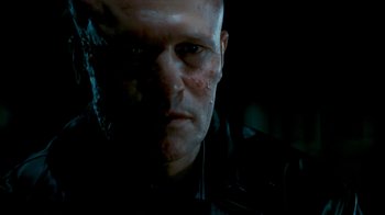 Movie still from “Slither” (2006), directed by James Gunn – A person wearing a black shirt; Close Up shot, Low angle