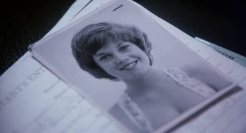 Movie still from “Smile” (1975), directed by Michael Ritchie – An old photo of a woman smiling for the camera; Extreme Close Up shot, Low angle