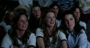 Movie still from “Smile” (1975), directed by Michael Ritchie – A group of young women sitting in a row; Close Up shot, Low angle