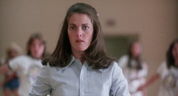 Movie still from “Smile” (1975), directed by Michael Ritchie – A woman with long hair is wearing a dress shirt; Close Up shot, Low angle