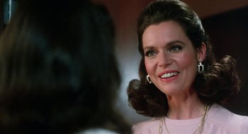 Movie still from “Smile” (1975), directed by Michael Ritchie – A person wearing a pink shirt; Close Up shot, Over the shoulder angle