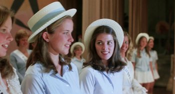 Movie still from “Smile” (1975), directed by Michael Ritchie – A group of young women wearing white hats and smiling; Close Up shot, Low angle