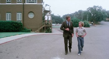 Movie still from “Smile” (1975), directed by Michael Ritchie – A man and a boy walking down a street; Wide shot, Over the shoulder angle