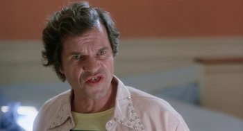 Movie still from “Smile” (1975), directed by Michael Ritchie – An older man in a yellow shirt and a pink shirt; Close Up shot, Low angle