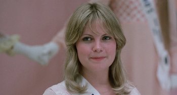 Movie still from “Smile” (1975), directed by Michael Ritchie – A person wearing a white shirt; Close Up shot, Over the shoulder angle