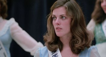 Movie still from “Smile” (1975), directed by Michael Ritchie – A person wearing a dress; Close Up shot, Low angle