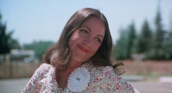 Movie still from “Smile” (1975), directed by Michael Ritchie – A person wearing a floral shirt; Close Up shot, Low angle