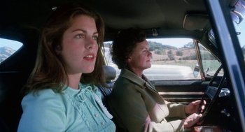 Movie still from “Smile” (1975), directed by Michael Ritchie – A woman and a woman sitting in the back of a car; Close Up shot, Low angle