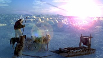 Movie still from “Smilla's Sense of Snow” (1997), directed by Bille August – A group of dogs standing on top of a snow covered slope; Wide shot, High angle
