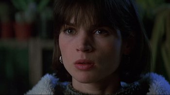 Movie still from “Smilla's Sense of Snow” (1997), directed by Bille August – A woman's face in a dark room; Close Up shot, Low angle