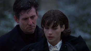 Movie still from “Smilla's Sense of Snow” (1997), directed by Bille August – A man and a woman standing next to each other in the snow; Close Up shot, Low angle