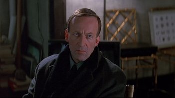 Movie still from “Smilla's Sense of Snow” (1997), directed by Bille August – A person wearing a suit and tie; Close Up shot, Low angle