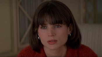 Movie still from “Smilla's Sense of Snow” (1997), directed by Bille August – A person wearing a red sweater; Close Up shot, High angle