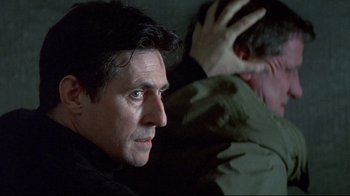 Movie still from “Smilla's Sense of Snow” (1997), directed by Bille August – A person sitting on a couch; Close Up shot, Over the shoulder angle