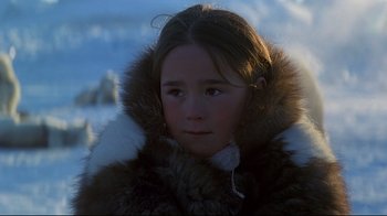 Movie still from “Smilla's Sense of Snow” (1997), directed by Bille August – A young girl wearing a fur coat in the snow; Close Up shot, Over the shoulder angle