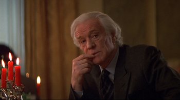 Movie still from “Smilla's Sense of Snow” (1997), directed by Bille August – An older man in a suit and tie; Close Up shot, Low angle
