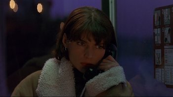 Movie still from “Smilla's Sense of Snow” (1997), directed by Bille August – A young woman is talking on the phone; Close Up shot, High angle