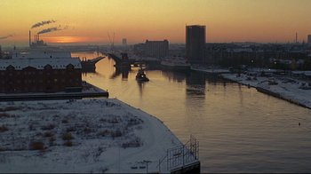 Movie still from “Smilla's Sense of Snow” (1997), directed by Bille August – A view of a river with a boat on it; Extreme Wide shot, High angle