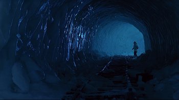 Movie still from “Smilla's Sense of Snow” (1997), directed by Bille August – A person standing in a tunnel with a train track; Extreme Wide shot, High angle