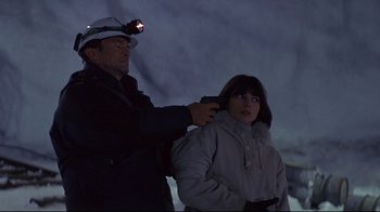 Movie still from “Smilla's Sense of Snow” (1997), directed by Bille August – A man and a girl in the dark with a flashlight; Medium shot, Low angle