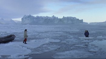 Movie still from “Smilla's Sense of Snow” (1997), directed by Bille August – A person standing on top of an ice covered lake; Extreme Wide shot, High angle