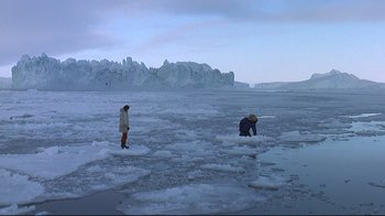 Movie still from “Smilla's Sense of Snow” (1997), directed by Bille August – Two people are standing in the middle of an ice floe; Extreme Wide shot, High angle