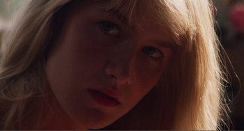 Movie still from “Smooth Talk” (1985), directed by Joyce Chopra – A young woman's face in the sunlight; Extreme Close Up shot, Low angle