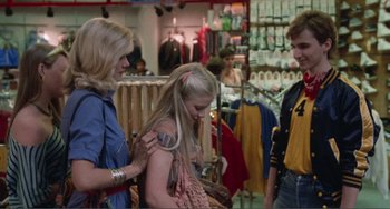 Movie still from “Smooth Talk” (1985), directed by Joyce Chopra – Two women and a young girl in a clothing store; Medium shot, Over the shoulder angle